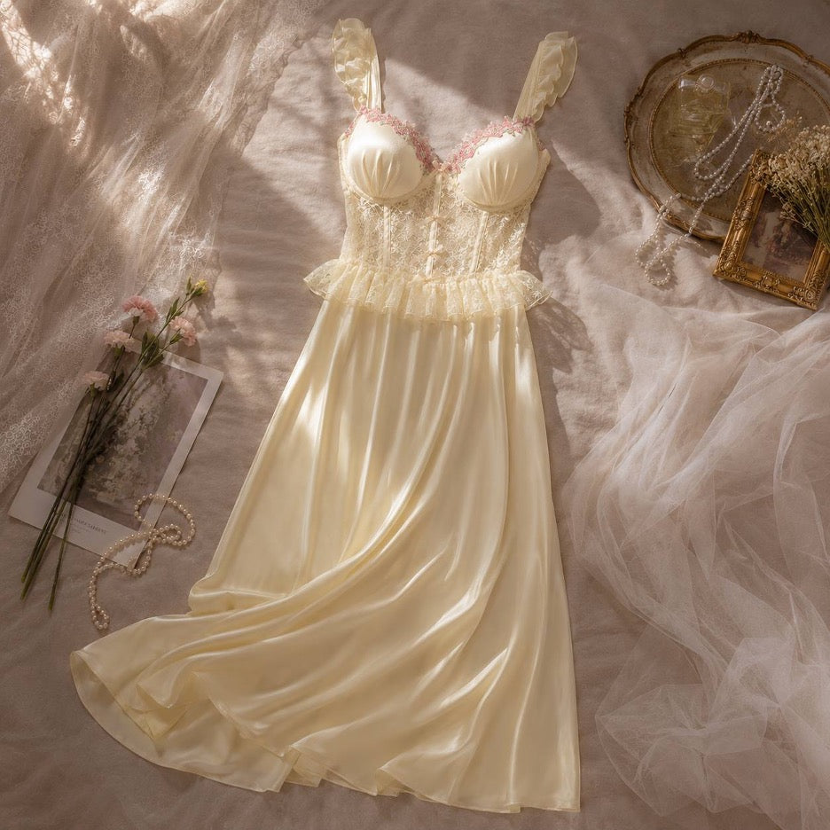 Dove Maxi Nightgown - Pale Yellow, seated close-up showing lace bodice detail and ribbon tie
